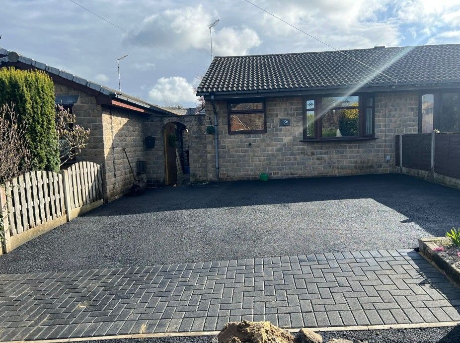 New tarmac driveway installed in Rotherham with a block paving entrance