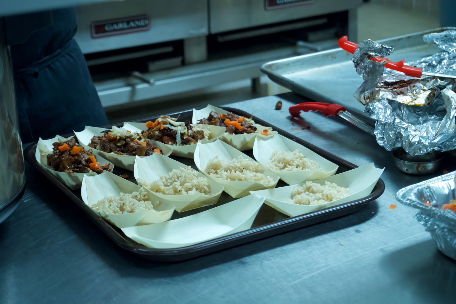 A tray of food is sitting on a counter in a kitchen.