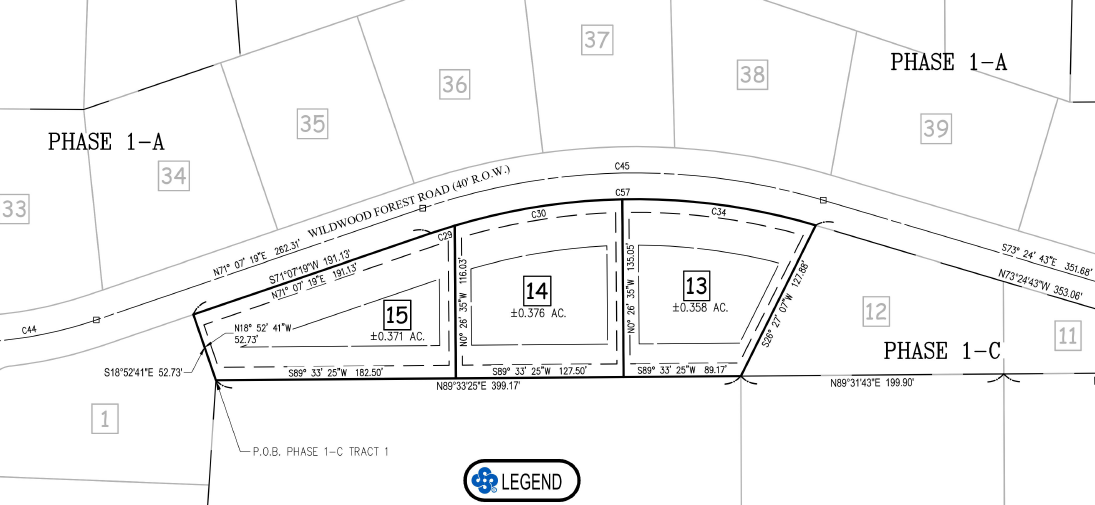 Land survey map with curved road and numbered parcels.