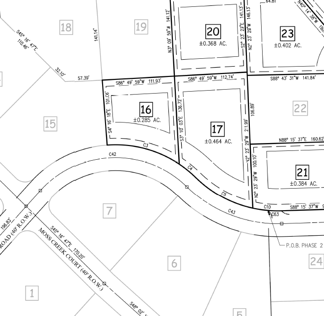 Land survey map showing plots of land with numbers and acreage, along roads.