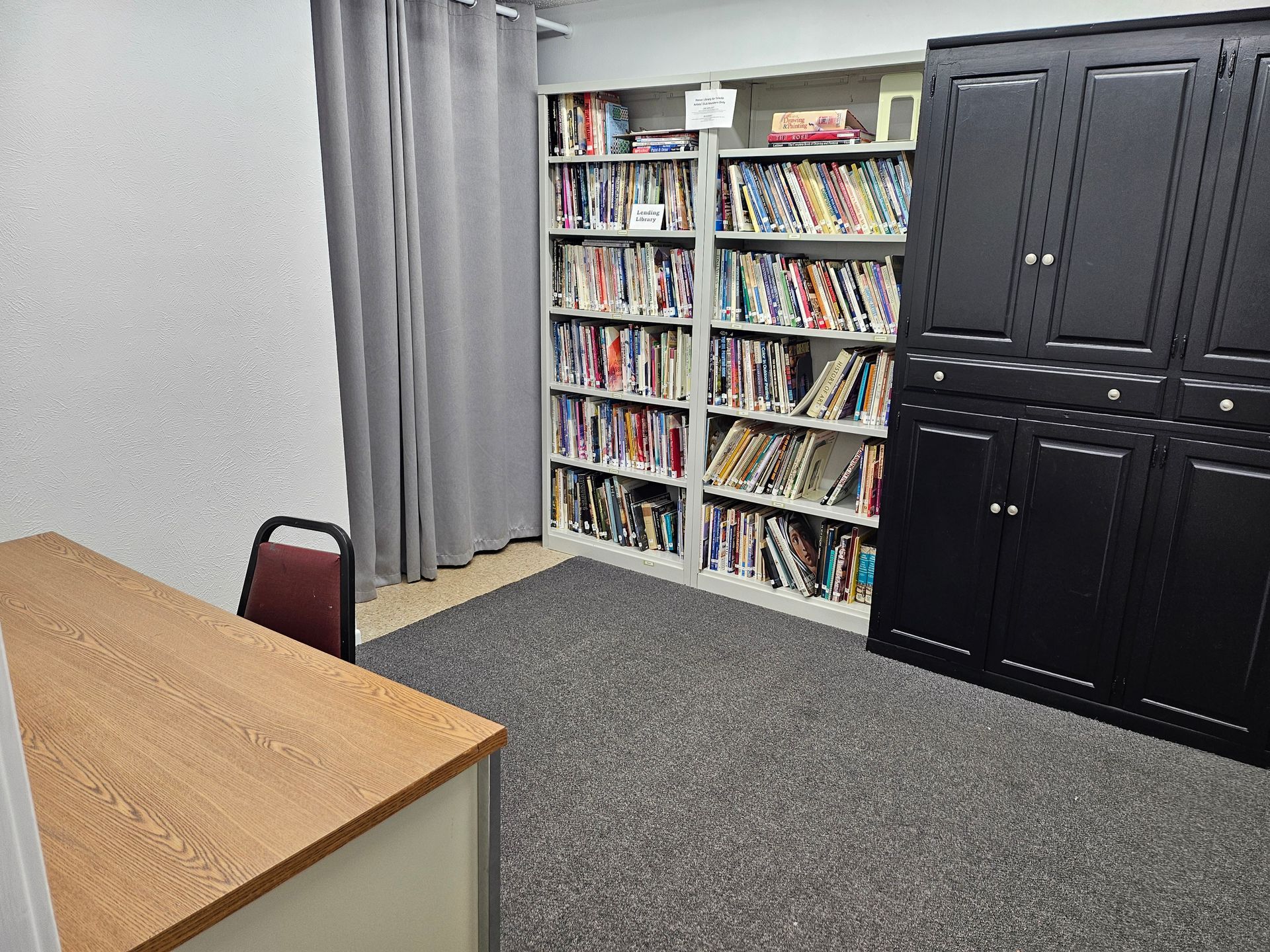 There are many books on the shelves in this room.