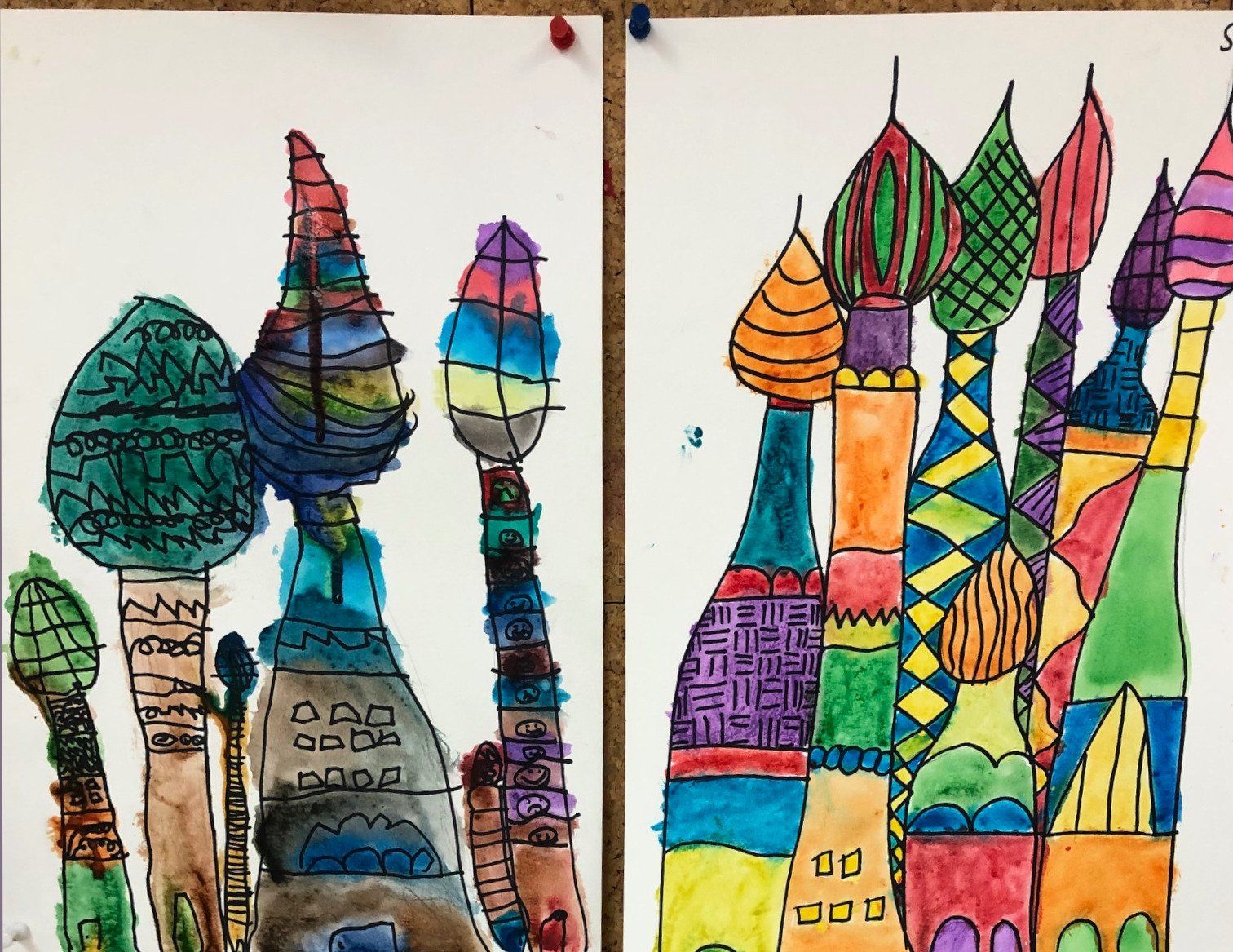 A child 's drawing of a castle with trees and buildings