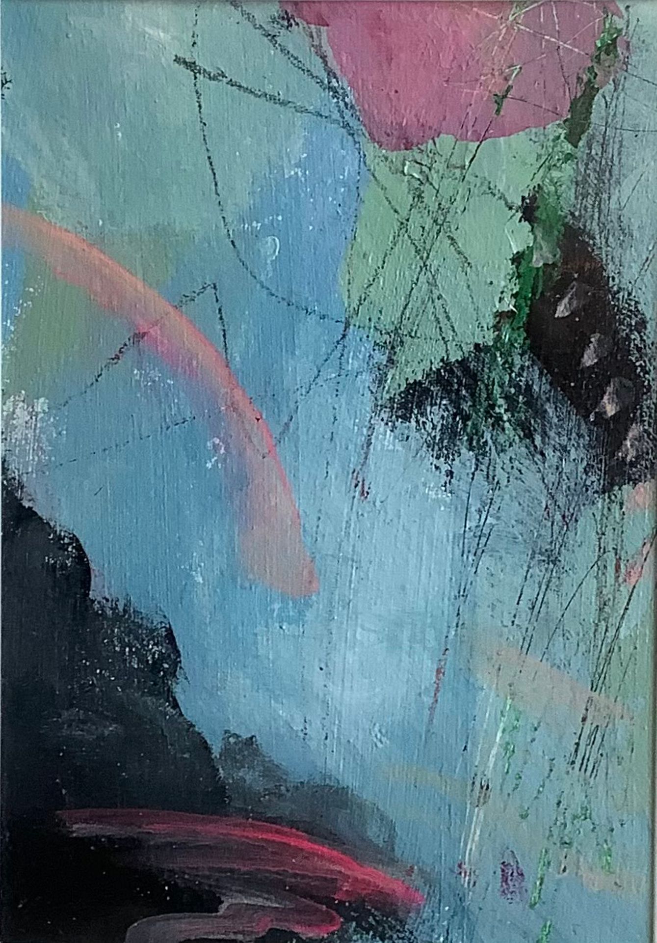 A painting of a rainbow on a blue background