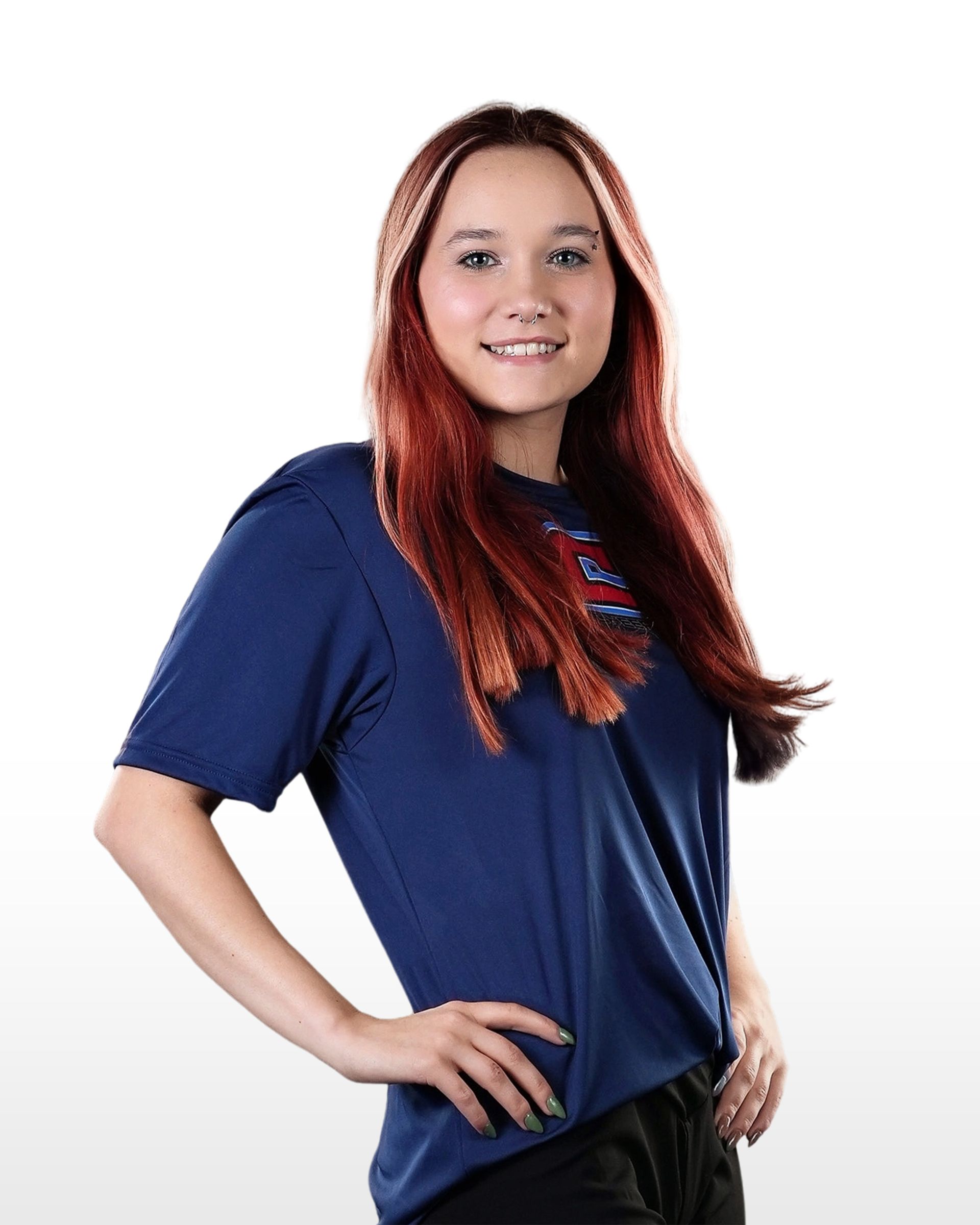 A woman with red hair is wearing a blue shirt and black shorts.