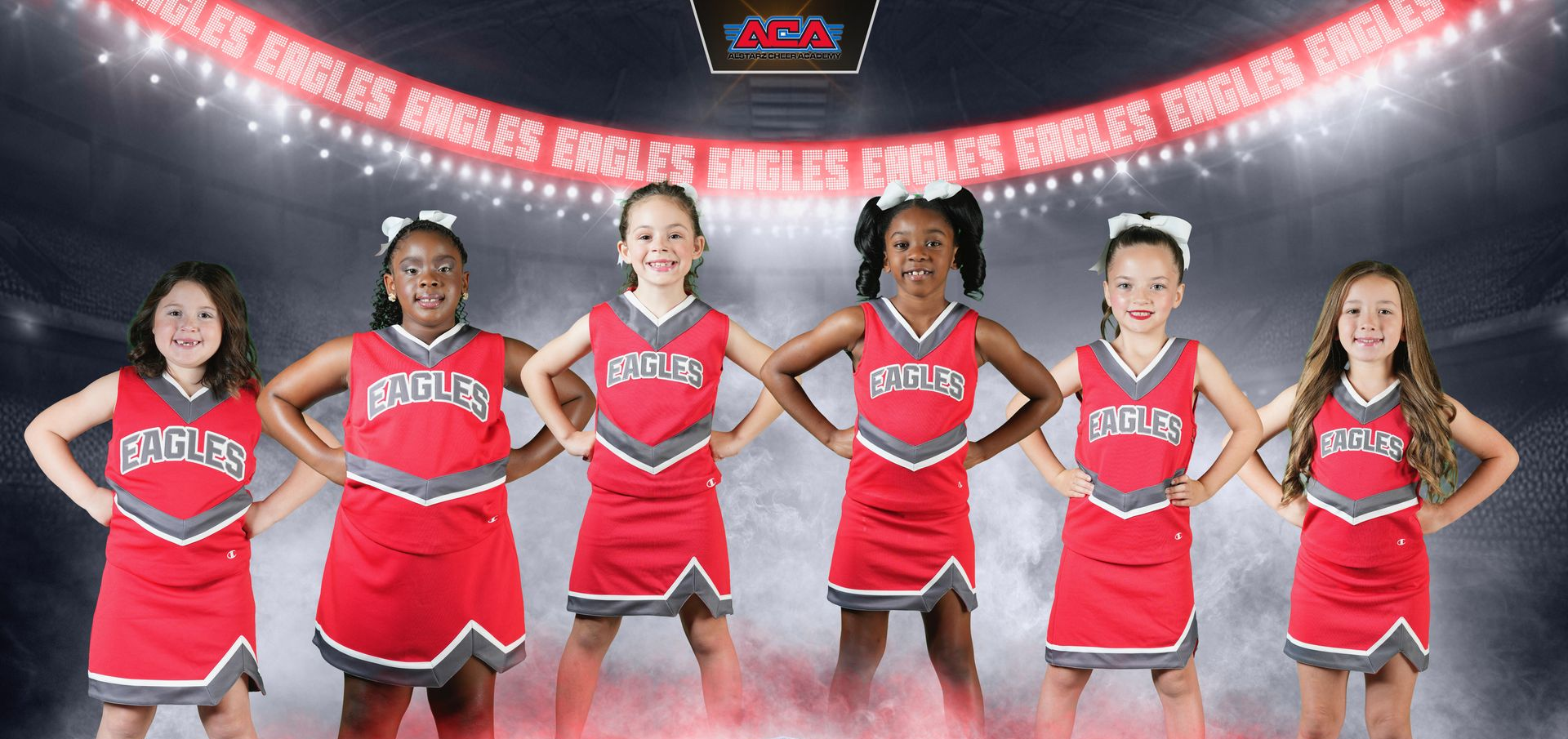 A little girl is wearing an eagles cheer uniform