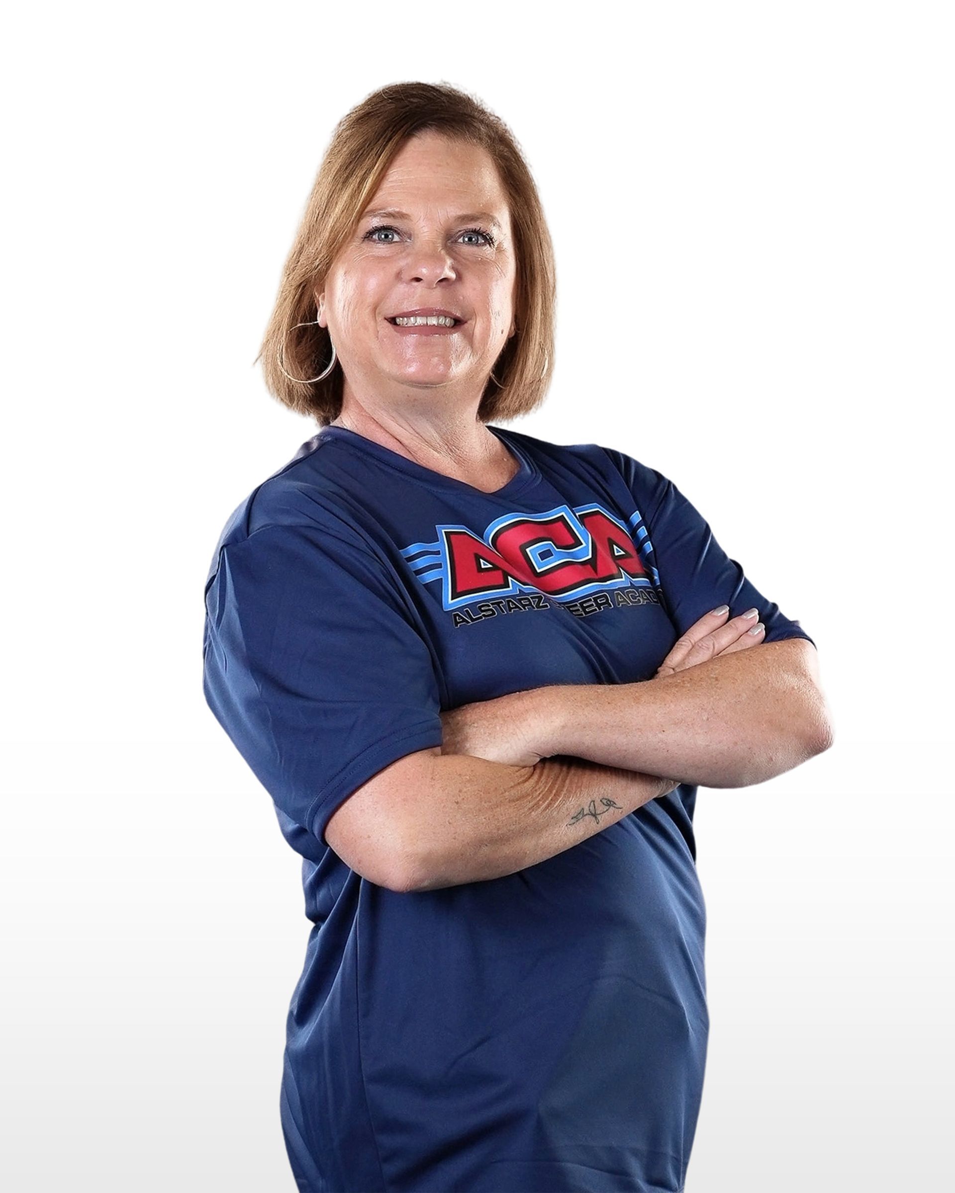 A woman wearing a blue shirt with the word aca on it