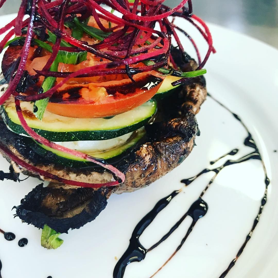 A close up of a plate of food with vegetables on it