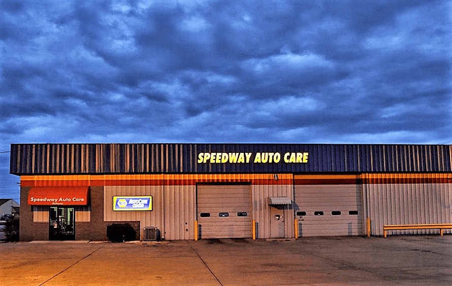 Speedway Auto Care storefront at dusk under a cloudy blue sky | Speedway Auto Care