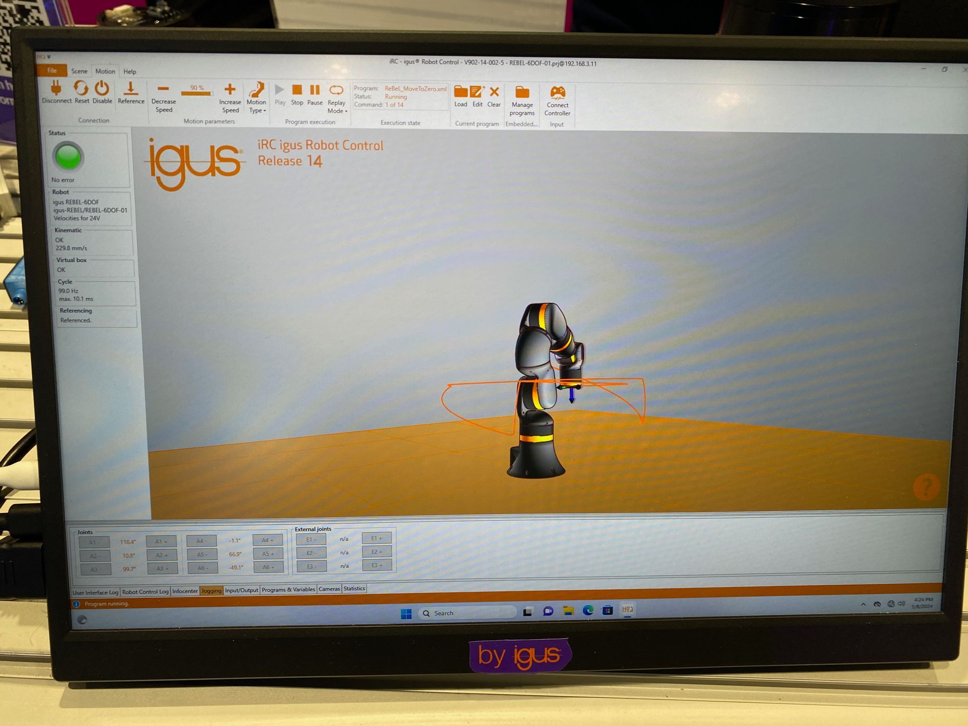 A computer monitor with a robot on it and the word igus at the top