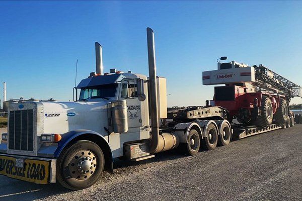 image of semi hauling large crane for project