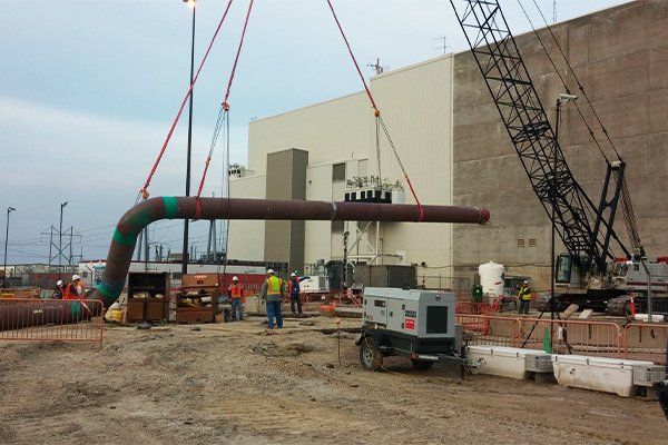image of crane at construction site installing panels
