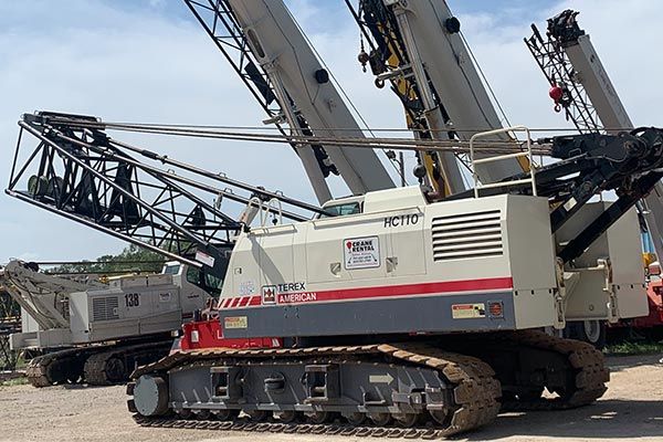 red, white and black crawler crane