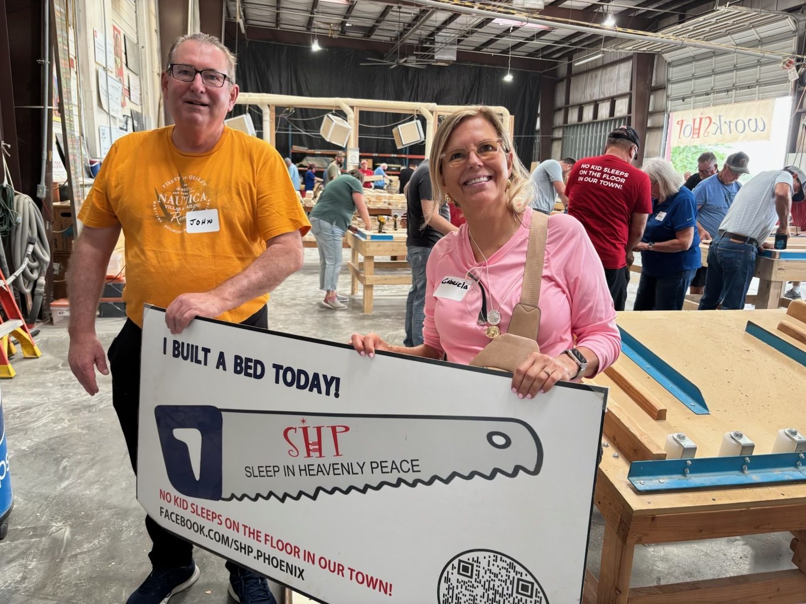 FFLC volunteers beside the bed-building workstations