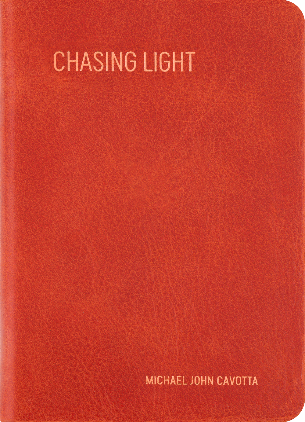 Orangebook cover titled “Chasing Light” with author name Michael John Covatta.
