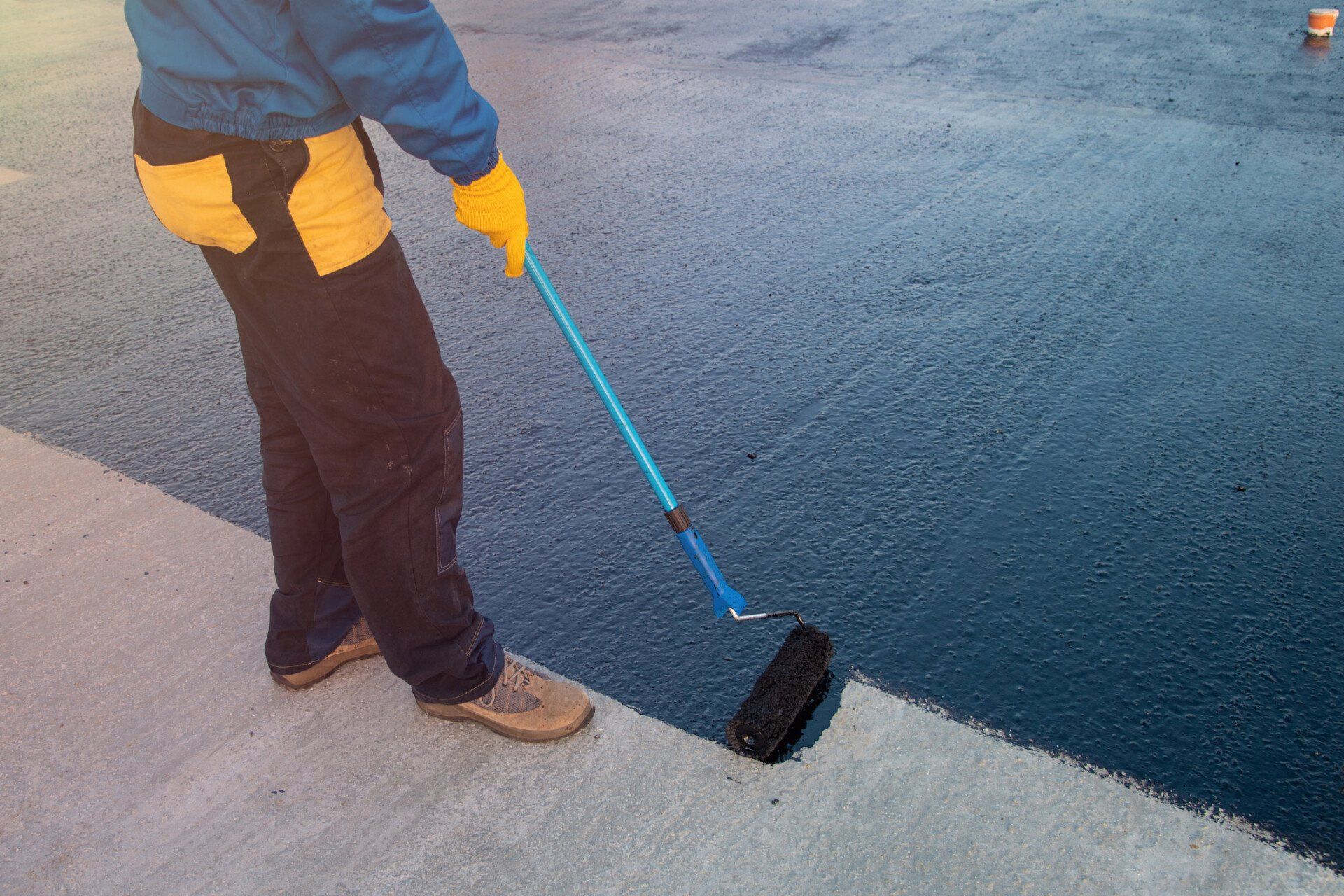 Applies Bitumen at Concrete Surface — Honolulu, HI — Central Pacific Specialty Contractors