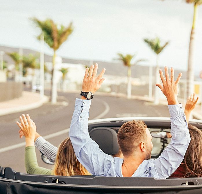 Friends celebrating in car | Japanese Auto Pros