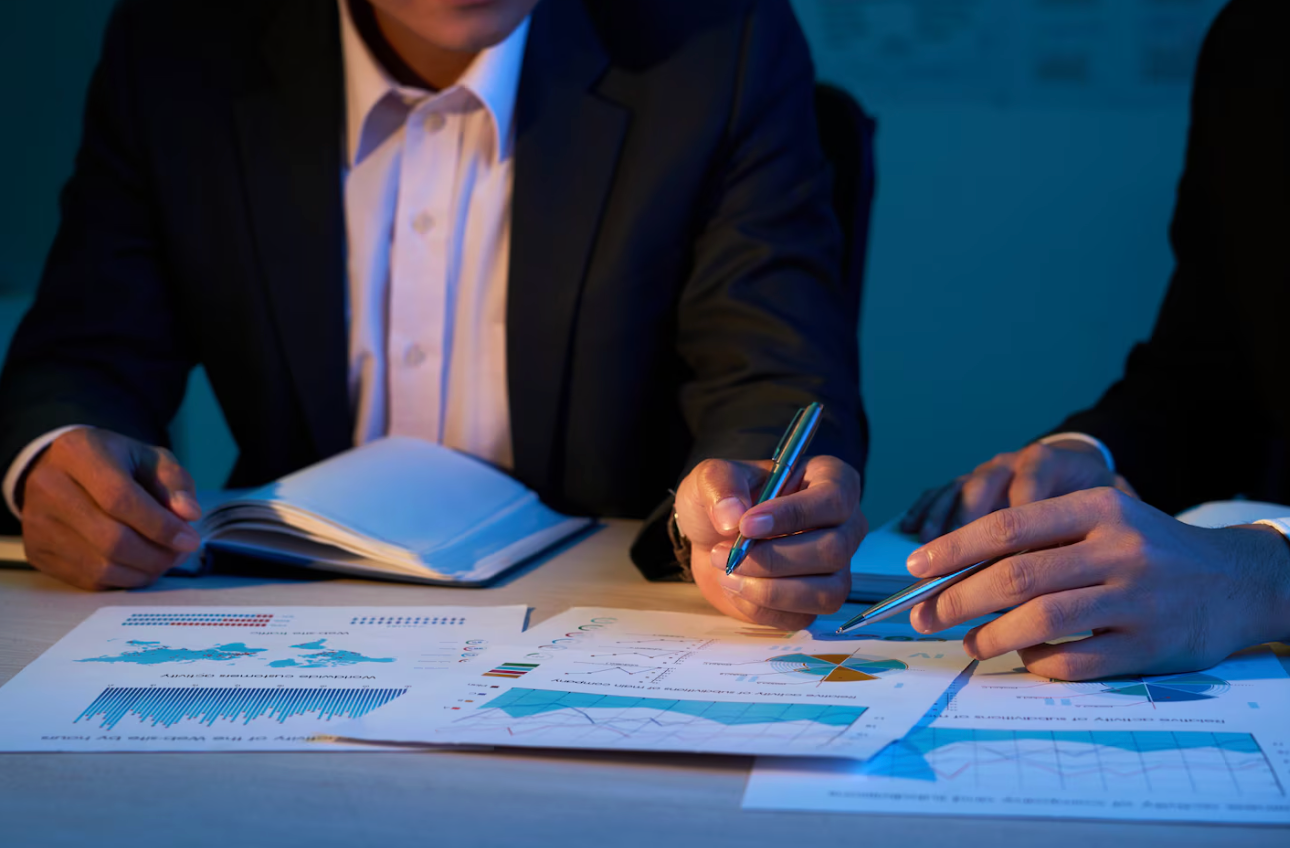 Business professionals reviewing investor diligence documents.