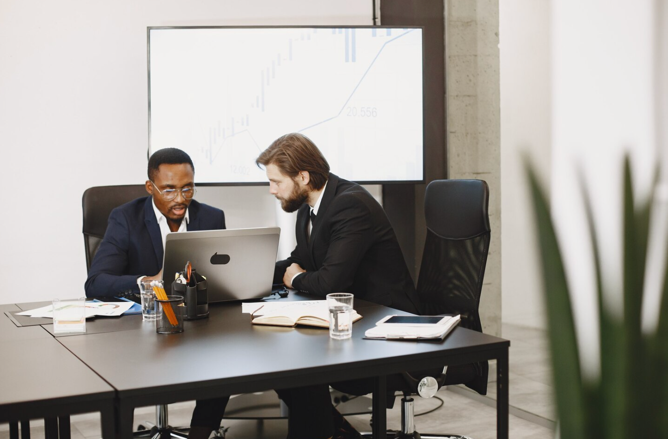 Lawyer in Los Angeles reviewing a contract with a client.