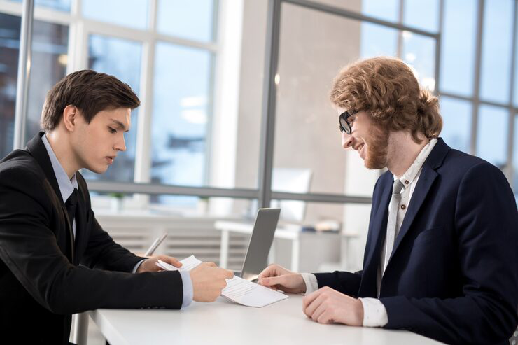 Business owner meeting with a corporate governance attorney to discuss company structure and compliance.