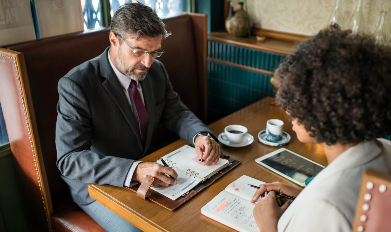 Business owner consulting with a securities lawyer about investment and fundraising matters.