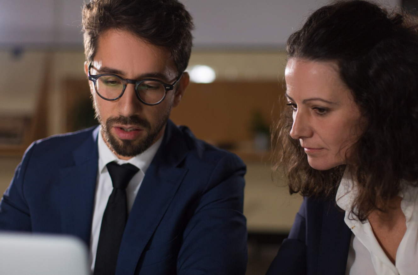 Corporate lawyer advising a business owner during a business sale.