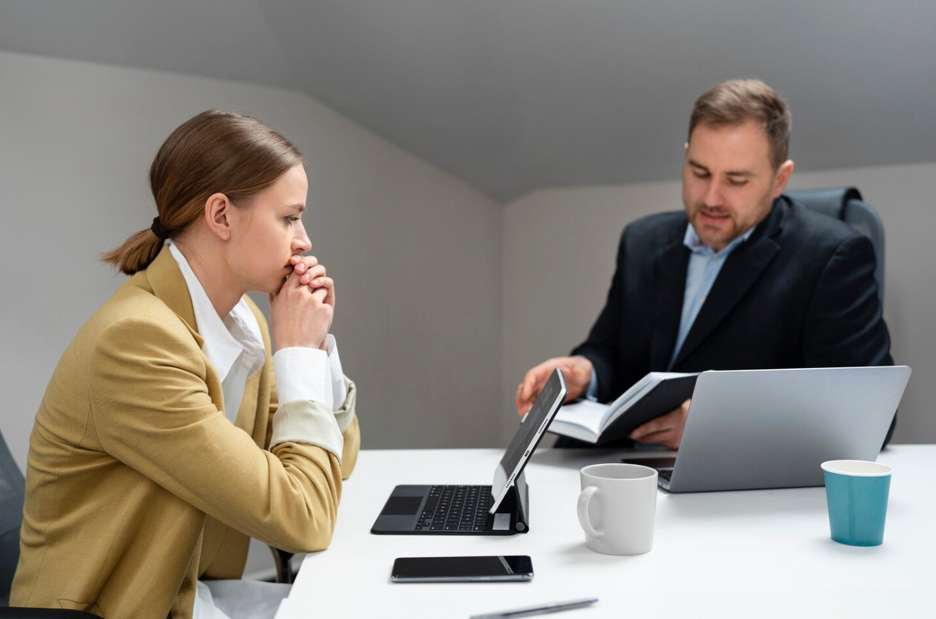 Business owner meeting with an attorney to discuss an ownership dispute and legal options.