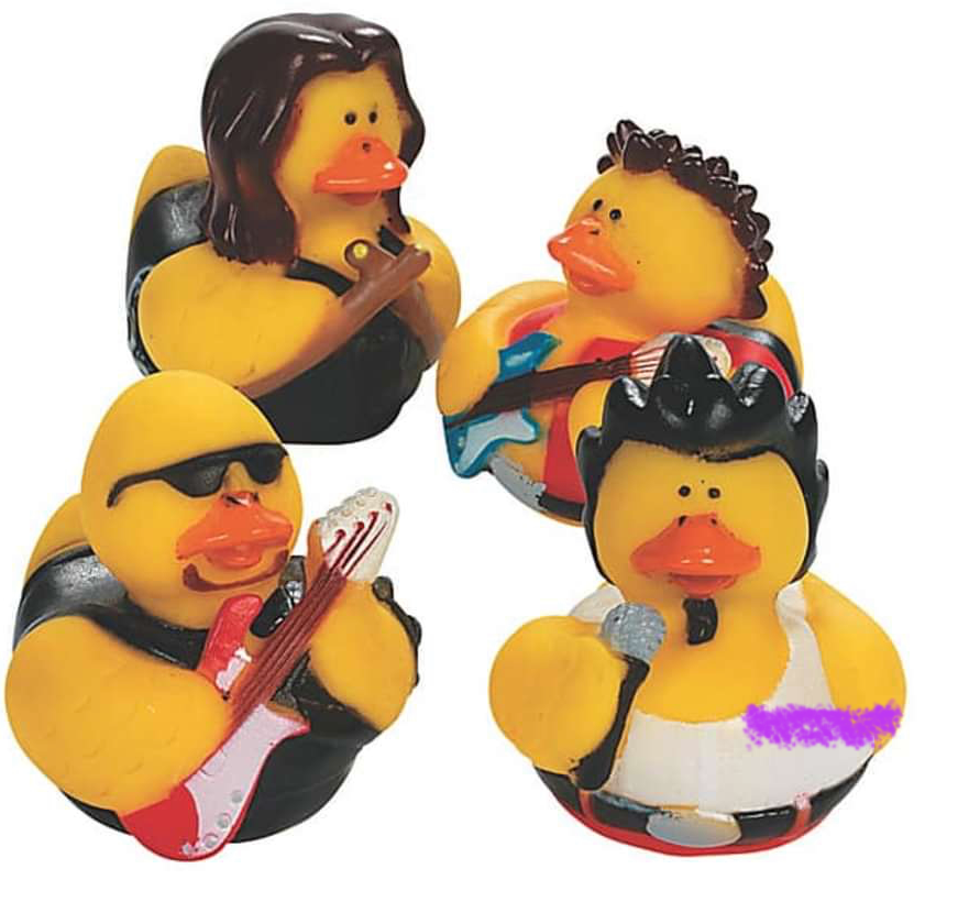 Four rubber duck figurines dressed as musicians on a white background
