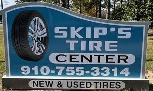 A Tire Shop With A Sign In Front Of It And Cars Parked In Front Of It - Leland, NC - Skip's Tire Center A Tire Shop With A Sign In Front Of It And Cars Parked In Front Of It - Leland, NC - Skip's Tire Center
