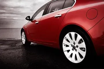 A Red Car Is Parked On The Side Of The Road - Leland, NC - Skip's Tire Center A Red Car Is Parked On The Side Of The Road - Leland, NC - Skip's Tire Center