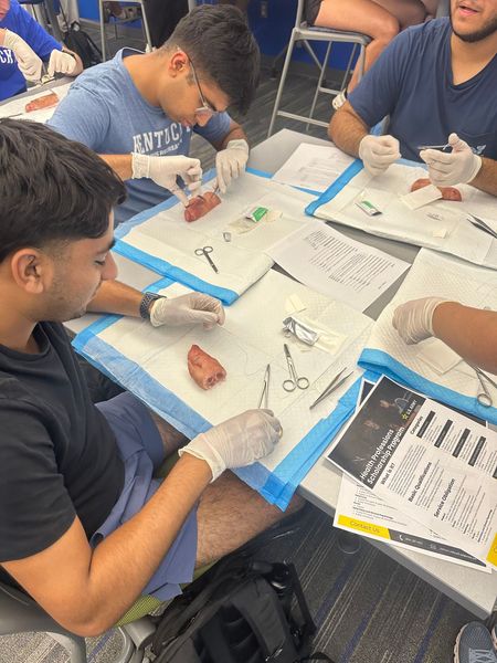 Medicats participating in a suture clinic 