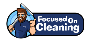 Focused on Cleaning Logo with white text and dark blue backgound with a bearded man holding acarpet cleaning tool to the left.