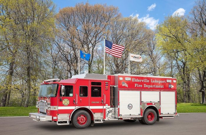 A red fire truck is parked on the side of the road.
