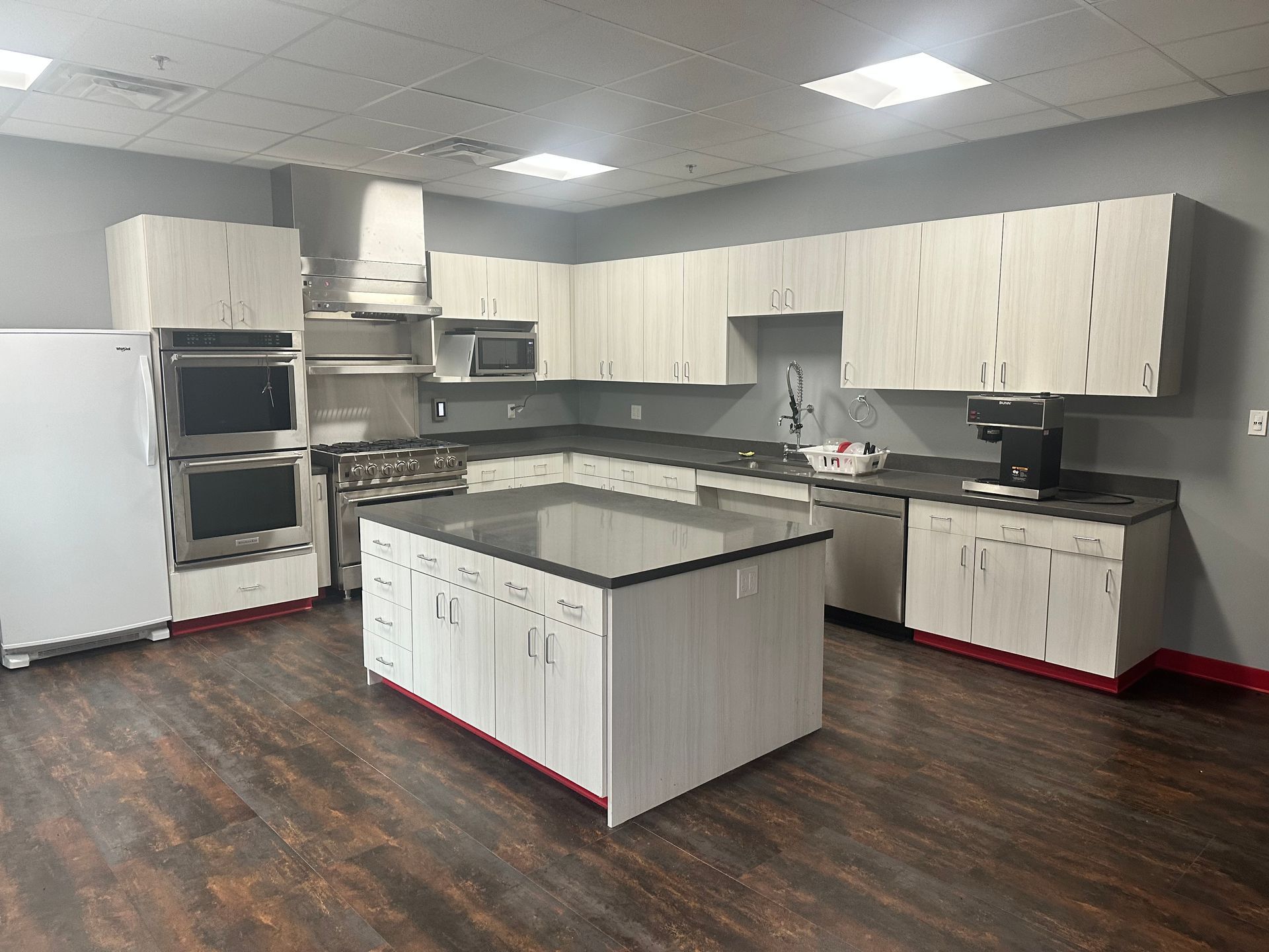 There is a large island in the middle of the kitchen.