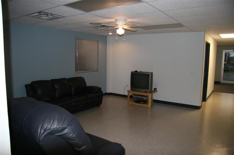 A living room with a couch and a television