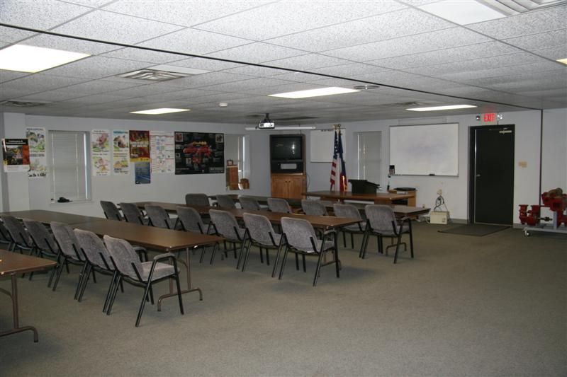 A large room with tables and chairs in it