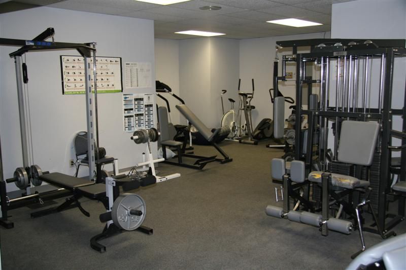 A gym filled with lots of exercise equipment