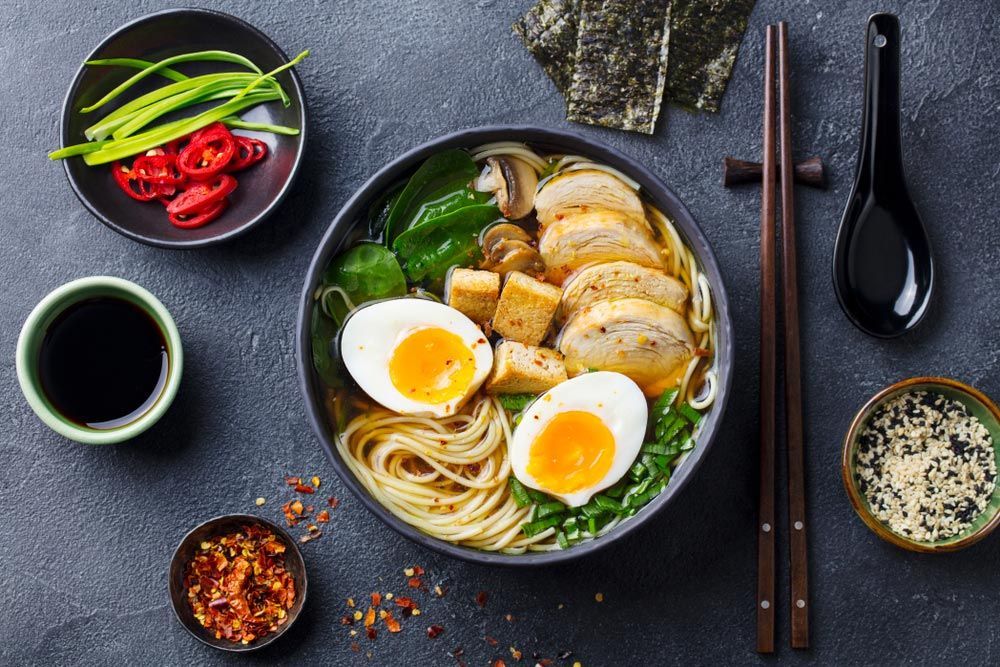 A Bowl Of Ramen With Chicken , Eggs , Mushrooms And Vegetables — One Thai Cuisine & Noodle Bar In Kirwan, QLD