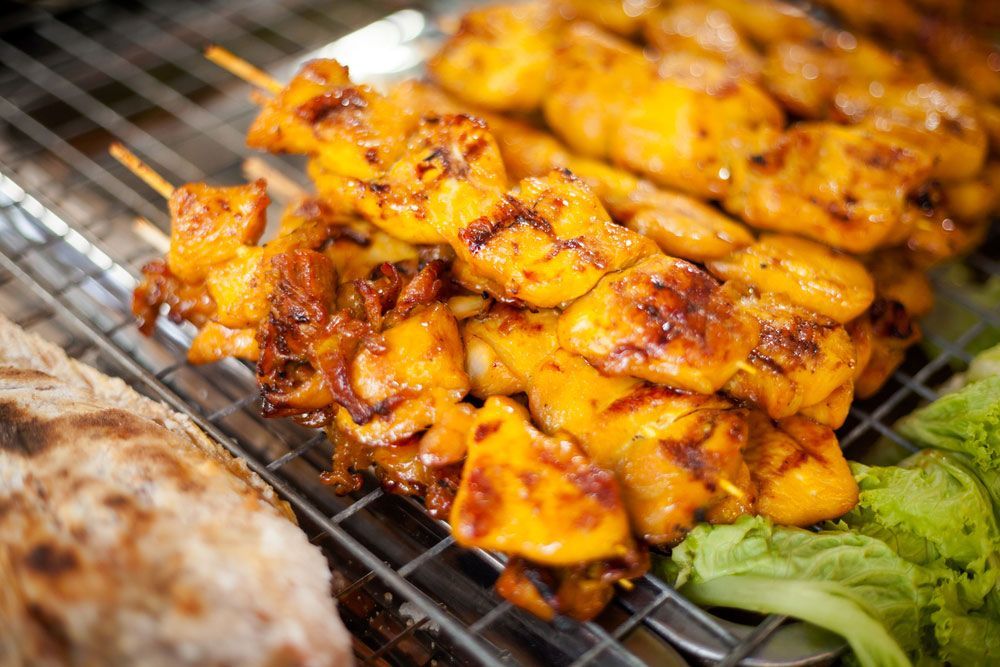 A Close Up Of Chicken Skewers On A Grill — One Thai Cuisine & Noodle Bar In Kirwan, QLD