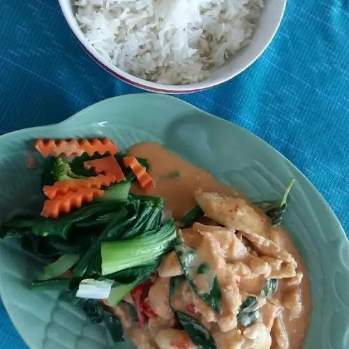 A Plate Of Food Next To A Bowl Of Rice — One Thai Cuisine & Noodle Bar In Kirwan, QLD
