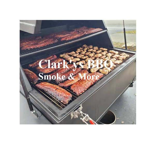 A large grill filled with meat and the words clark 's bbq smoke & more