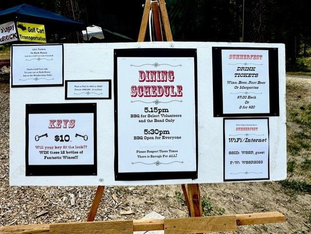 A dining schedule is displayed on a wooden easel