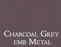 a close up of a charcoal grey embossed metal .