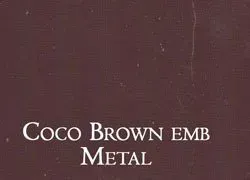 a close up of a piece of paper with the words `` coco brown emb metal '' written on it .