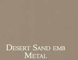 a close up of a desert sand embossed metal paint .