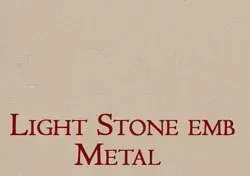 a picture of a light stone embossed metal .