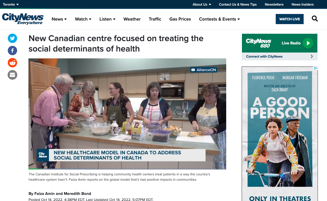 A group of people are cooking in a kitchen on a website.