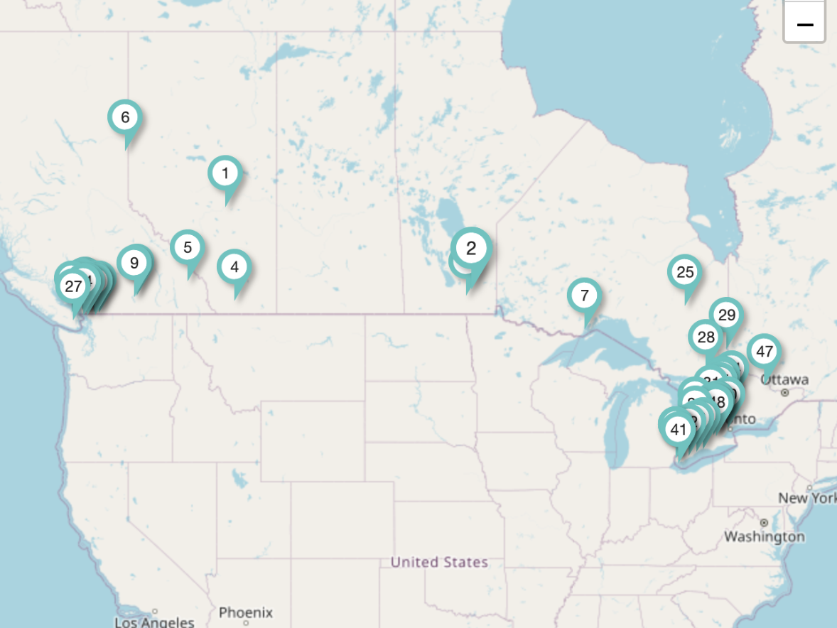 A map of the united states and canada with pins on it