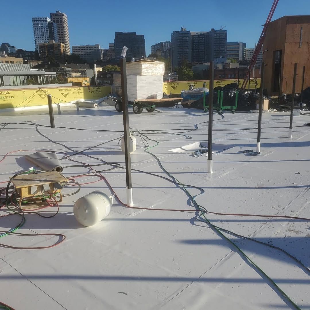 A white roof with a lot of wires on it