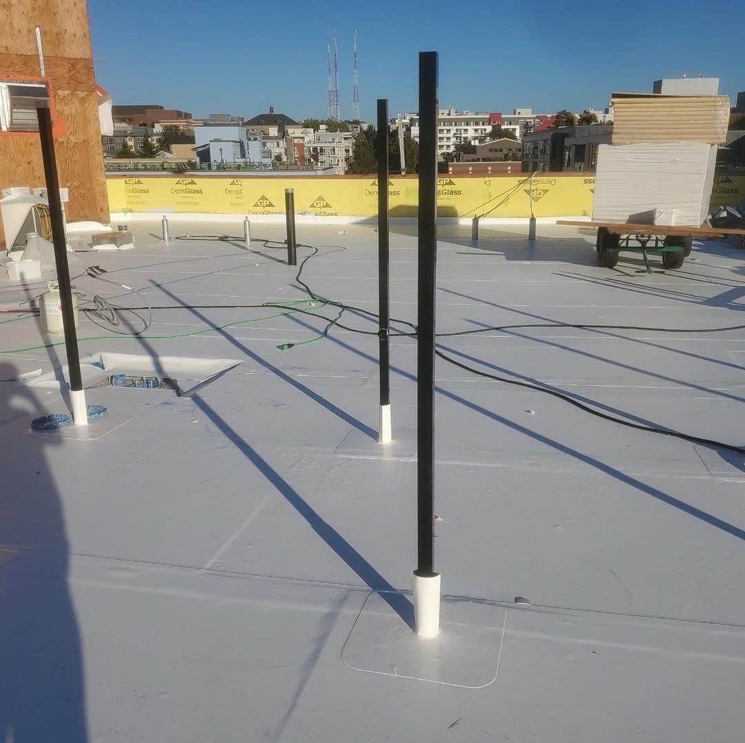 A white roof with black poles on it