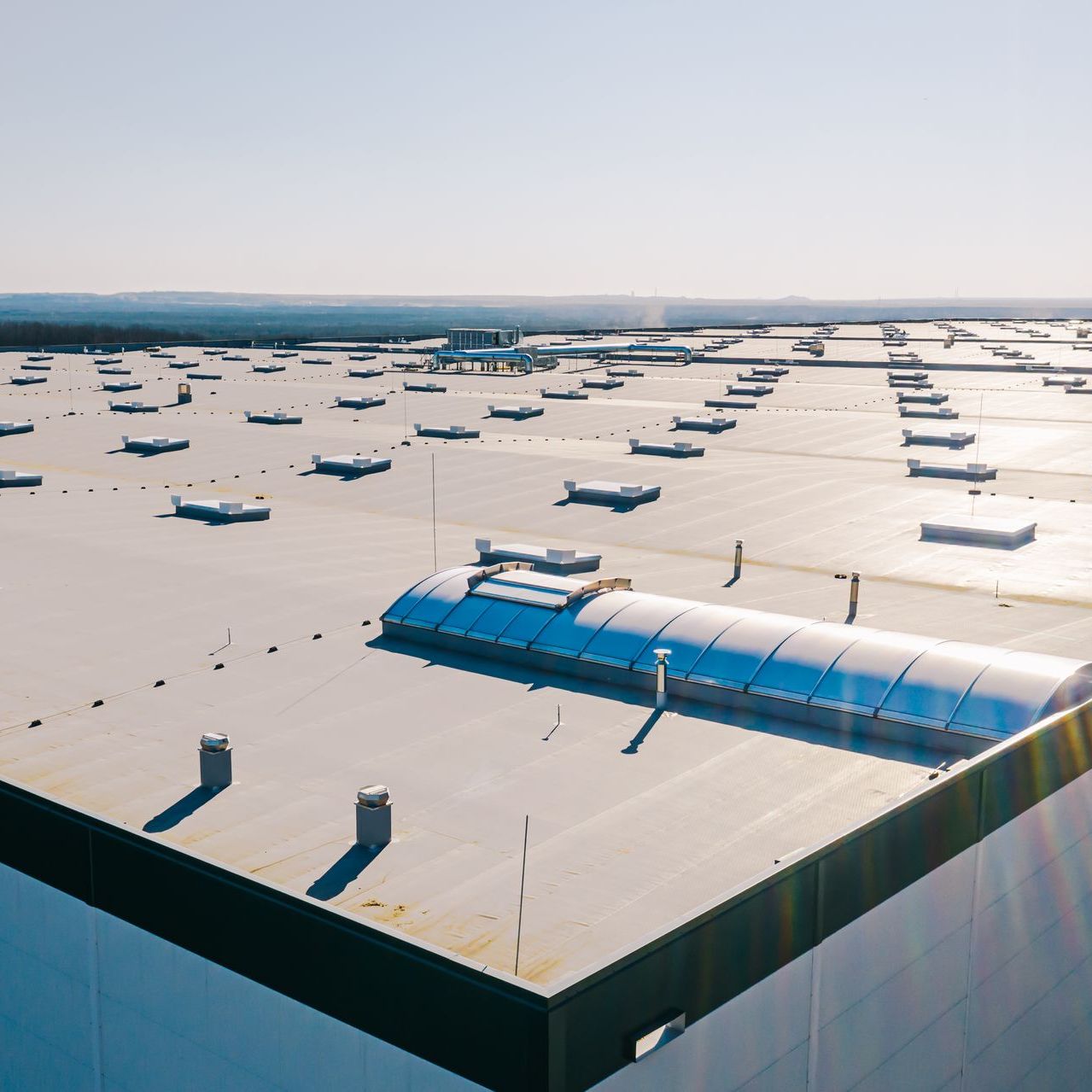 An aerial view of the roof of a large commercial building